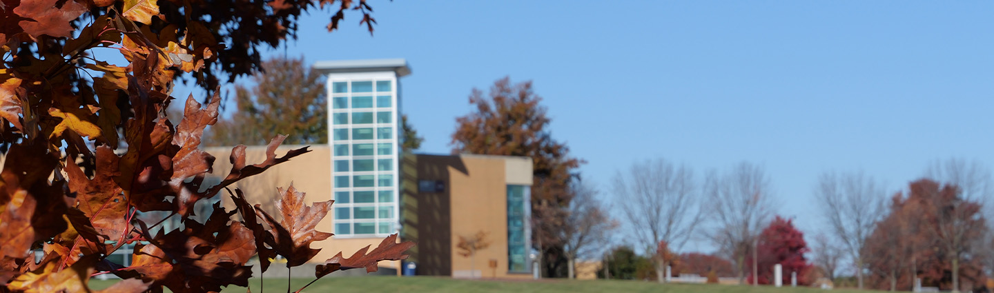 View of the Technology Building with Autumn Trees in the Foreground